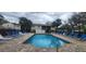 A community pool with lounge chairs offers residents a place to relax and socialize at 411 Banana Cay Dr # C, South Daytona, FL 32119