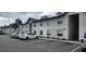 Well-kept apartment building with parking spaces and landscaped grounds at 411 Banana Cay Dr # C, South Daytona, FL 32119