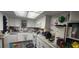 Bright kitchen with white cabinets, modern appliances, and plenty of countertop space at 411 Banana Cay Dr # C, South Daytona, FL 32119