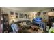 Cozy living room with gray sectional, fireplace, television, and decorative wall art at 411 Banana Cay Dr # C, South Daytona, FL 32119