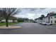 Expansive parking lot serving the apartments, with multiple rows of cars and lush greenery at 411 Banana Cay Dr # C, South Daytona, FL 32119