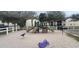 Community playground with slides, climbing structures, and a sandy play area at 411 Banana Cay Dr # C, South Daytona, FL 32119