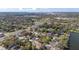 Aerial view highlighting the home's proximity to Daytona Racetrack and a nearby lake at 414 Ellsworth St, Daytona Beach, FL 32114