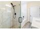Luxurious bathroom featuring a marble-tiled shower with black fixtures and a modern glass enclosure at 414 Ellsworth St, Daytona Beach, FL 32114