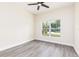 Light bedroom with fan and stylish vinyl flooring at 414 Ellsworth St, Daytona Beach, FL 32114