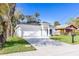 Inviting single-Gathering home with a well-manicured lawn, a two-car garage, and modern architectural details at 414 Ellsworth St, Daytona Beach, FL 32114