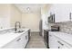 Modern kitchen with white cabinets, stainless steel appliances, and stylish backsplash at 414 Ellsworth St, Daytona Beach, FL 32114