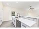 Bright kitchen with white cabinets, sleek countertops, and modern stainless steel appliances at 414 Ellsworth St, Daytona Beach, FL 32114