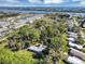 This aerial view shows the home's proximity to a waterway, as well as other homes in the charming neighborhood at 4282 Alice St, Edgewater, FL 32141