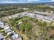 This high aerial view of the property shows its close proximity to other homes and a beautiful green space at 4282 Alice St, Edgewater, FL 32141