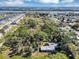 The aerial view of this home shows its proximity to a waterway and other lovely single Gathering homes at 4282 Alice St, Edgewater, FL 32141