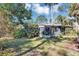 Screened in back patio with view of mature trees and green lawn at 4282 Alice St, Edgewater, FL 32141
