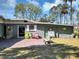 A cute backyard with a patio and seating, offers a peaceful retreat with a relaxing outdoor ambiance at 4282 Alice St, Edgewater, FL 32141