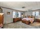 Bedroom with wood furnishings, ceiling fan, and two windows for natural light at 4282 Alice St, Edgewater, FL 32141