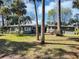 Charming exterior of this green single-story home features a paved patio with colorful outdoor seating at 4282 Alice St, Edgewater, FL 32141