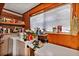Functional laundry room with vintage appliances, shelves, and ample storage space at 4282 Alice St, Edgewater, FL 32141