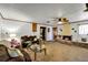 Living room features a brick fireplace, ceiling fan and furniture at 4282 Alice St, Edgewater, FL 32141