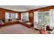 Inviting living room with wood paneling, natural light, and custom daybed at 4282 Alice St, Edgewater, FL 32141