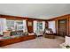 Cozy living room with wood paneling, natural light, and comfortable seating at 4282 Alice St, Edgewater, FL 32141