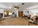 A spacious living room with carpet, ceiling fan and hardwood trim at 4282 Alice St, Edgewater, FL 32141