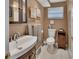 Bathroom with vanity sink, toilet, towels, and a walk-in shower at 435 N Oak Ave, Orange City, FL 32763