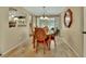 Cozy dining room featuring a chandelier, dining table, and easy access to the outdoor pool area at 435 N Oak Ave, Orange City, FL 32763