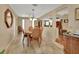 Elegant dining room with hardwood floors, chandelier, and ornate wooden dining set at 435 N Oak Ave, Orange City, FL 32763