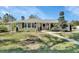 Charming single-story home with a well-manicured lawn and inviting front porch in a residential neighborhood at 435 N Oak Ave, Orange City, FL 32763