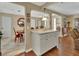 Open kitchen with island looking into a dining area and living space, ideal for entertaining at 435 N Oak Ave, Orange City, FL 32763
