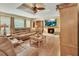 Comfortable living room featuring hardwood floors, a fireplace, and leather couches for a cozy atmosphere at 435 N Oak Ave, Orange City, FL 32763