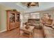 Spacious living room with hardwood floors that offers comfortable seating with a view into the kitchen at 435 N Oak Ave, Orange City, FL 32763