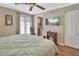 Bright main bedroom with access to en-suite bathroom and access to the outside patio area at 435 N Oak Ave, Orange City, FL 32763