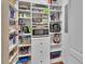 Well-organized walk-in pantry featuring shelving, drawers and ample storage space at 435 N Oak Ave, Orange City, FL 32763