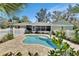 Backyard pool area with a screened in porch, pool, brick pavers and fenced yard at 435 N Oak Ave, Orange City, FL 32763