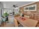 Inviting porch with a dining table, chairs, and cozy decorations at 435 N Oak Ave, Orange City, FL 32763