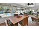 Bright porch with outdoor dining overlooking the pool and backyard at 435 N Oak Ave, Orange City, FL 32763