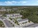 A beautiful aerial view of a well-maintained townhouse community with a sparkling blue pool at 471 Portico Ct, Oviedo, FL 32765