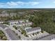 A beautiful aerial view of a well-maintained townhouse community with a sparkling blue pool at 471 Portico Ct, Oviedo, FL 32765