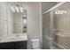 Bathroom featuring a glass shower, modern vanity and a view of the outdoors at 471 Portico Ct, Oviedo, FL 32765