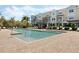 The community pool features lounge seating and is surrounded by well maintained landscaping at 471 Portico Ct, Oviedo, FL 32765