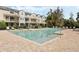 A large community pool with lounge chairs and tables available for residents at 471 Portico Ct, Oviedo, FL 32765