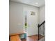 Bright entryway featuring sidelight windows, wood bench and hardwood floors for a warm welcome at 471 Portico Ct, Oviedo, FL 32765