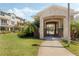 Exterior view of pool entrance featuring a stone facade and lush landscaping at 471 Portico Ct, Oviedo, FL 32765