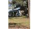 View of the backyard through the trees at 485 Dickson Ave, Osteen, FL 32764