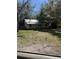 A charming single-story home with a covered porch and metal roof sits on a spacious lot at 485 Dickson Ave, Osteen, FL 32764
