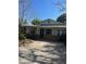Charming single-story home with a stone accent, mature landscaping, and ample parking space at 485 Dickson Ave, Osteen, FL 32764