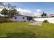 Spacious backyard with lush green grass, offering plenty of space for outdoor activities and relaxation at 509 Mcintosh Rd, Ormond Beach, FL 32174