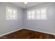 Bright bedroom boasts hardwood flooring, plantation shutters, and a calming ambiance at 509 Mcintosh Rd, Ormond Beach, FL 32174
