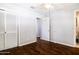 The bedroom offers wood floors, closet with louvered doors, and an ensuite bathroom for convenience at 509 Mcintosh Rd, Ormond Beach, FL 32174