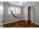 The bedroom is highlighted by plantation shutters, hardwood flooring, and ample storage space at 509 Mcintosh Rd, Ormond Beach, FL 32174